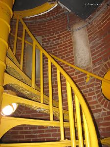Near the top of the tower.