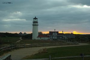 Sun sets behind the lighthouse.