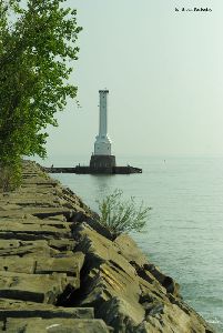 Breakwall in the foreground, lighthouse in the background.