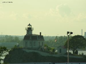 The lighthouse sits offshore.