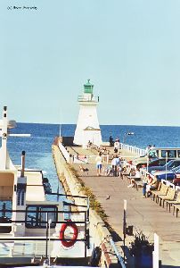 The lighthouse stands watch over the lake.