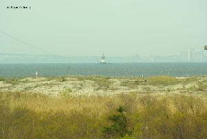 The tower with the Verrazano-Narrows Bridge in the background.
