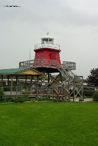 The lighthouse at home in the fishing village.
