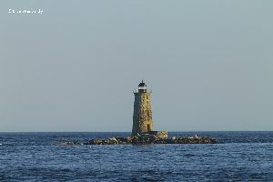 Beautiful photo of the Whaleback Lighthouse at sunset.